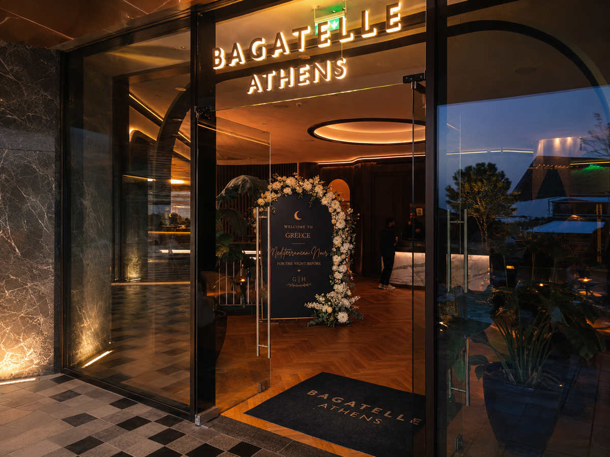 Luxury destination wedding welcome sign with white floral decoration in Athens Greece