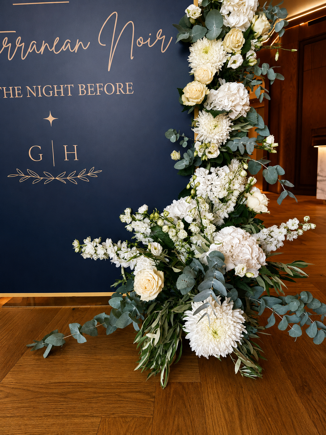 Luxury white wedding flowers in Greece with hydrangeas, orchids and roses